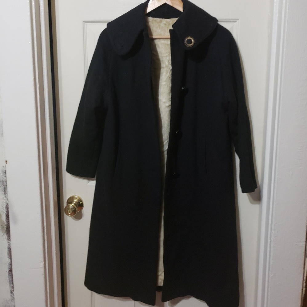 1960s vintage black coat with plush lining.